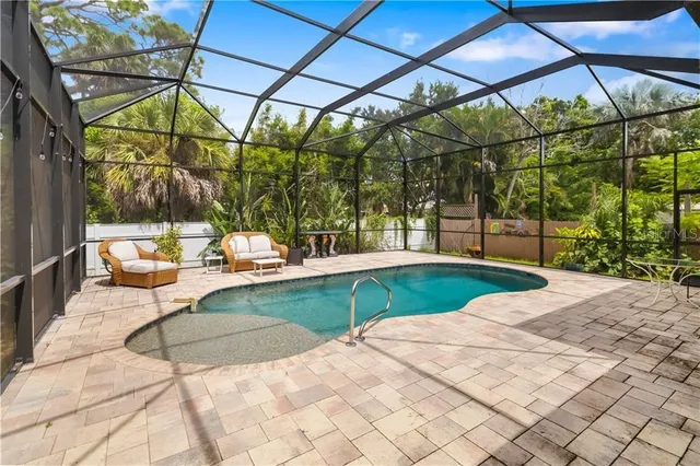 a view of swimming pool with a patio