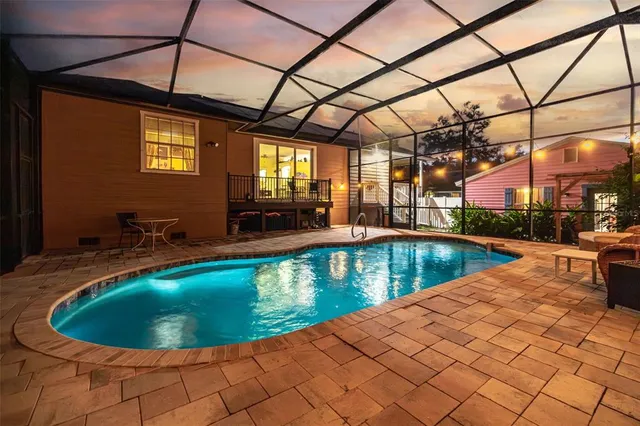 a view of a swimming pool with a patio