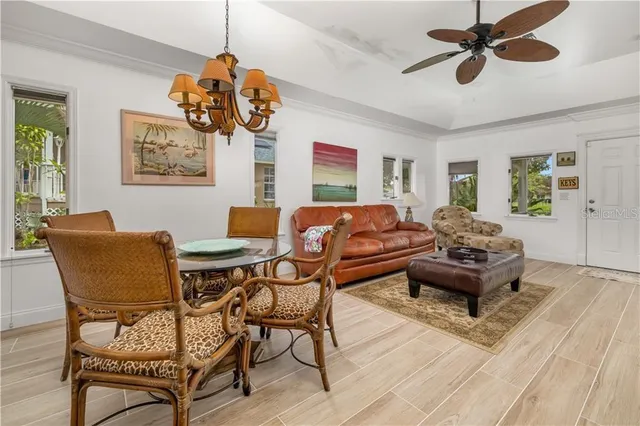 a living room with a couch and a chandelier