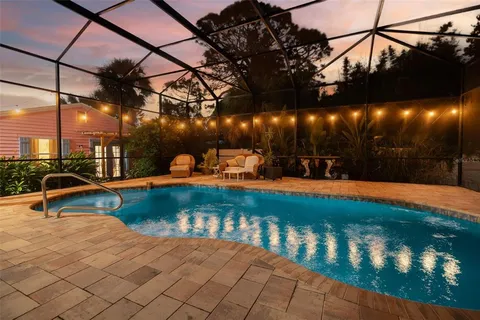 a view of a swimming pool with a bench