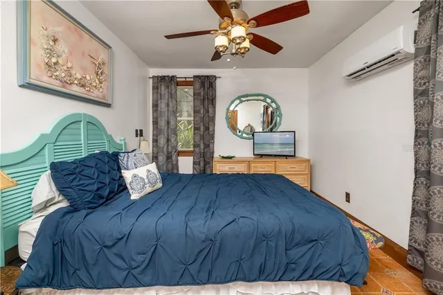 a living room with a bed furniture and a window