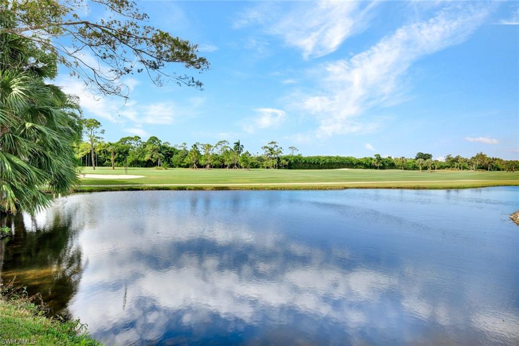 202 Bears Paw Trail, Unit 97 Naples, FL 34105 - Photo 28 of 28 a view of a golf course with a lake