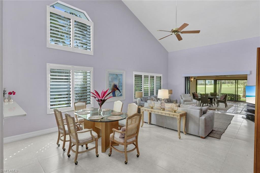 202 Bears Paw Trail, Unit 97 Naples, FL 34105 - Photo 10 of 28 a view of a dining room with furniture window and outside view