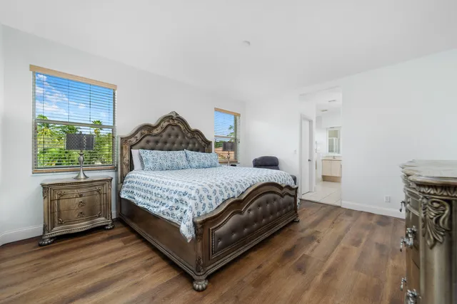 a bedroom with a bed and a fireplace