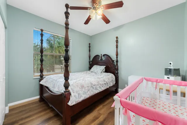 a bed room with bed and window