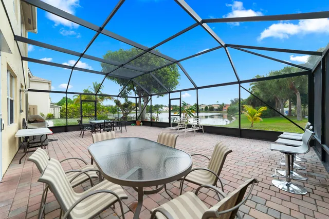 a view of a patio with a table and chairs