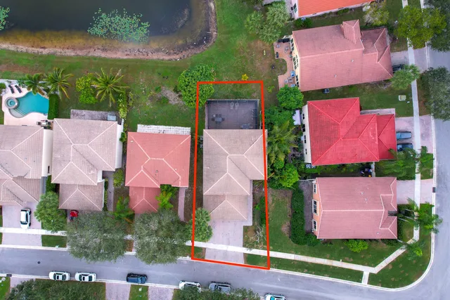 an aerial view of residential house with outdoor space and street view