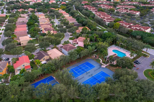 an aerial view of residential house with outdoor space and swimming pool