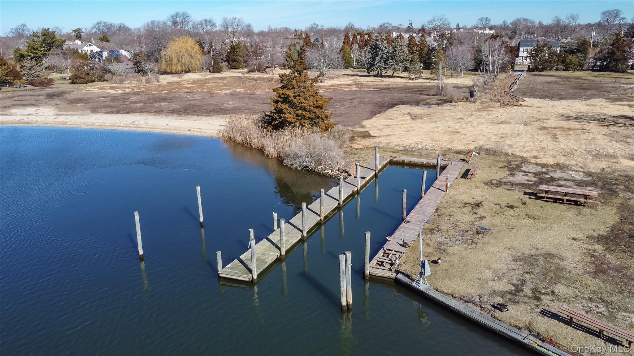 66 Cedar Lane Babylon, NY 11702 - Photo 2 of 4 a view of a yard next to a building