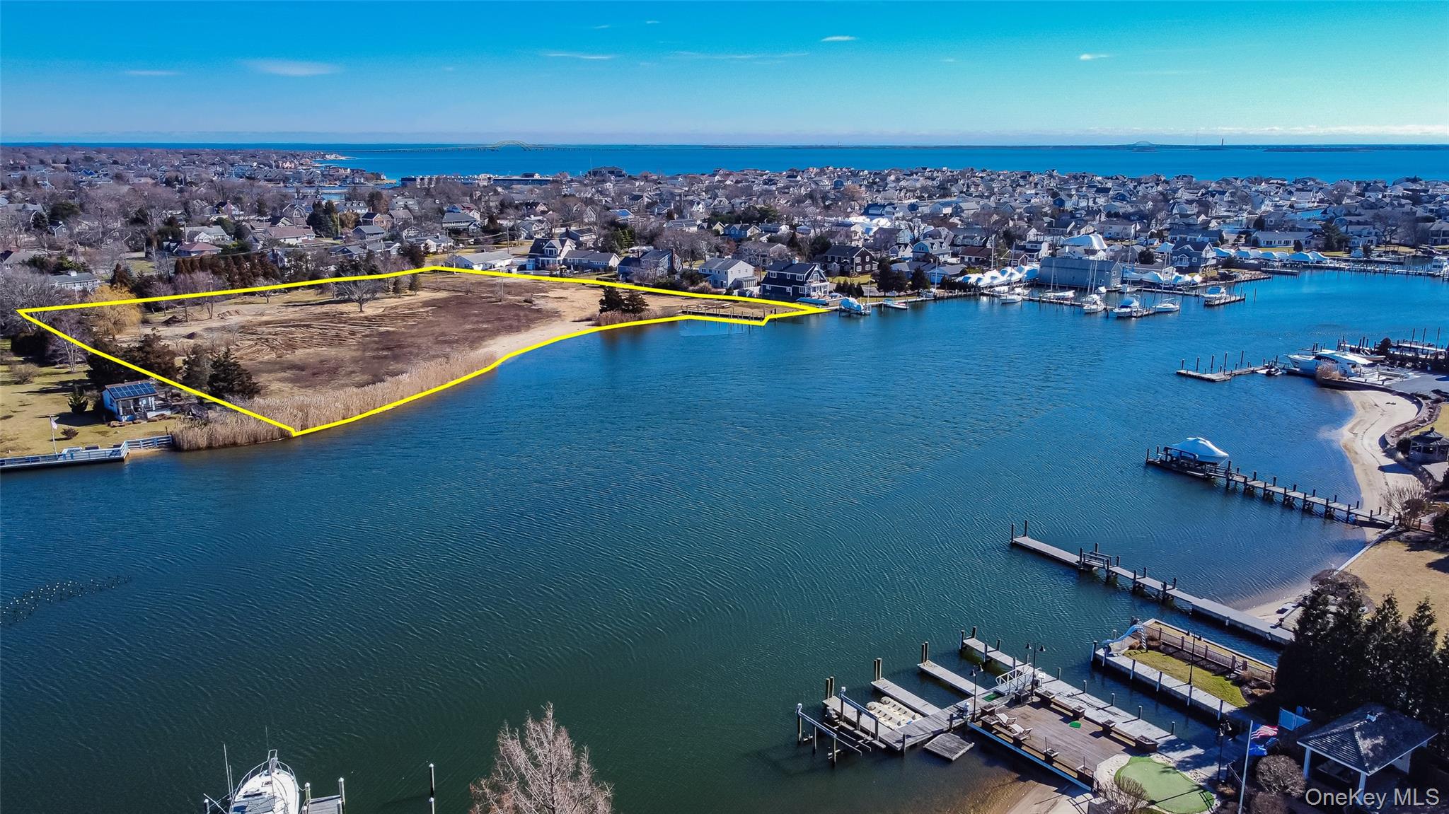 66 Cedar Lane Babylon, NY 11702 - Photo 3 of 4 an aerial view of a house with a ocean view