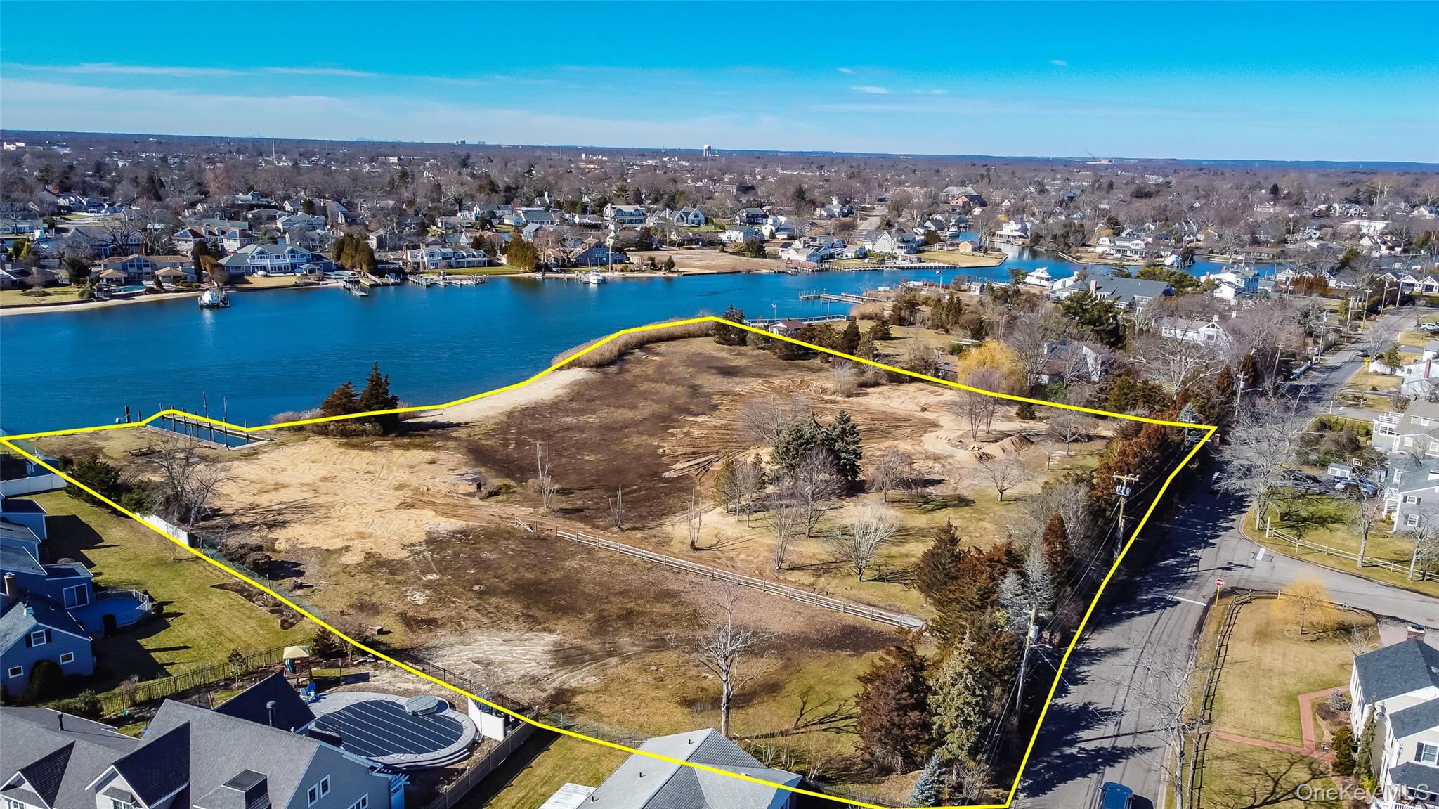 66 Cedar Lane Babylon, NY 11702 - Photo 4 of 4 an aerial view of residential houses with outdoor space