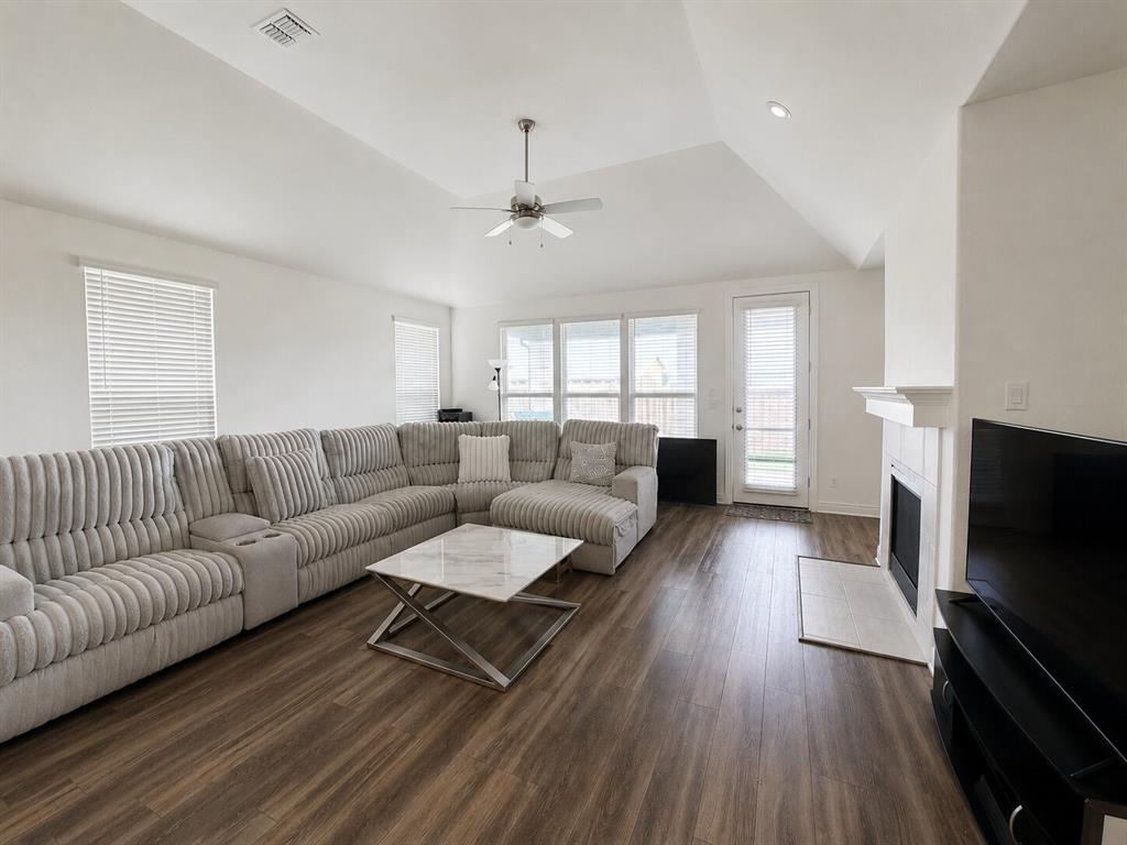 3598 Furrow Road Frisco, TX 75035 - Photo 8 of 14 a living room with fireplace furniture and a flat screen tv