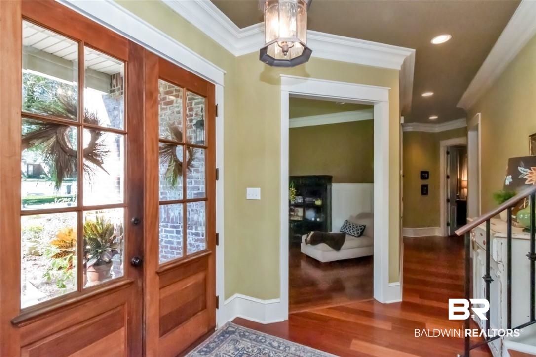 8868 Dawes Lake Road South Mobile, AL 36619 - Photo 6 of 35 Entryway featuring ornamental molding, wood-type flooring, and a wealth of natural light