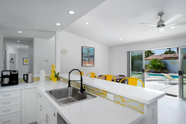 a kitchen with a sink and a refrigerator
