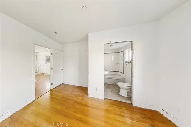 a bathroom with a toilet sink and shower