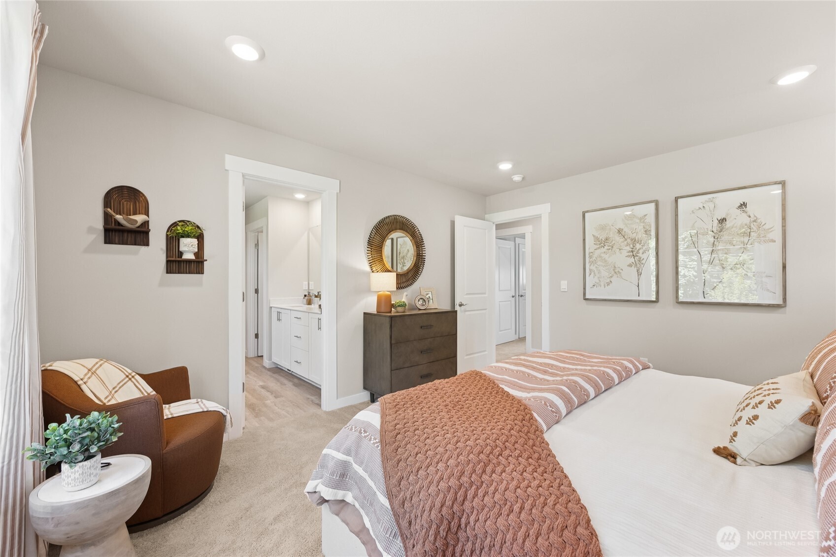 26866 Northeast 143rd Circle, Unit 19 Duvall, WA 98019 - Photo 16 of 29 a bedroom with a large bed and a couch