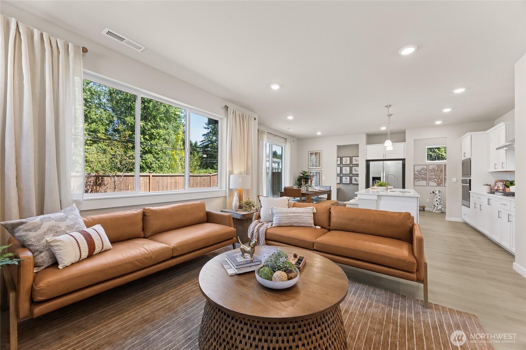 26866 Northeast 143rd Circle, Unit 19 Duvall, WA 98019 - Photo 3 of 29 a living room with furniture and a large window