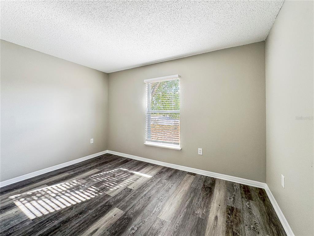 Undisclosed Address Spring Hill, FL 34609 - Photo 12 of 18 a view of an empty room and window