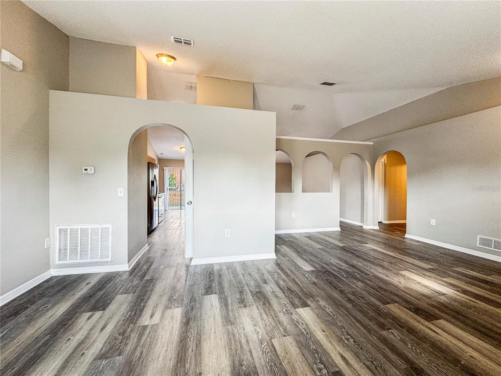 Undisclosed Address Spring Hill, FL 34609 - Photo 3 of 18 a view of a room with wooden floor