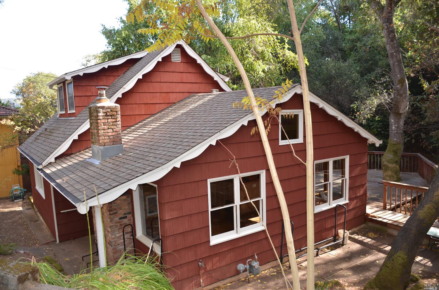 a aerial view of a house with a yard