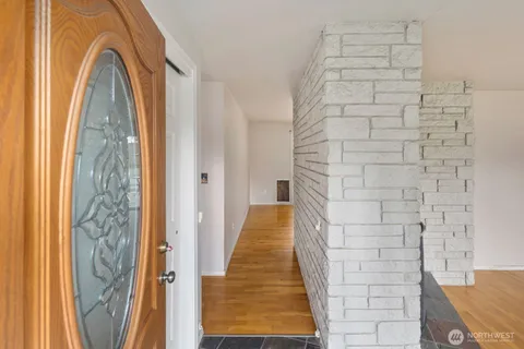 a bedroom with a bed and a fireplace