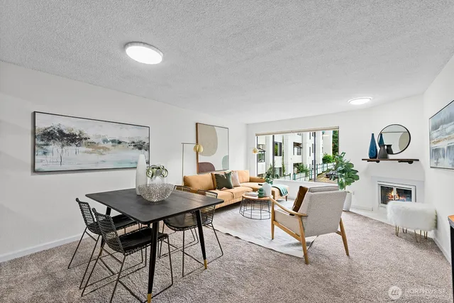 a living room with furniture a window and a table