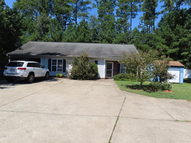 a view of house with outdoor space and street view