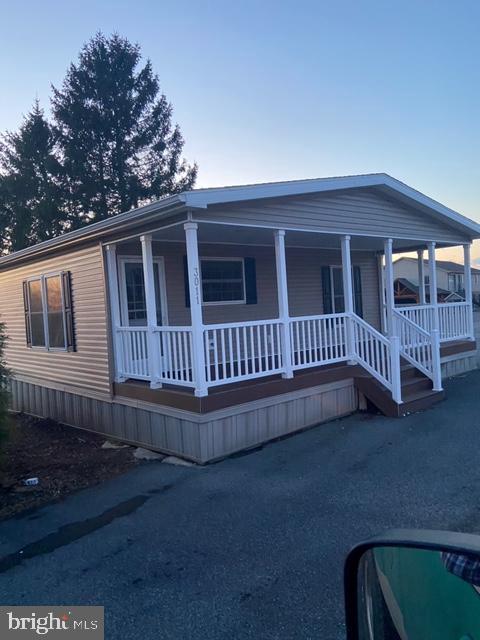 1296 Rawlinsville Road New Providence, PA 17560 - Photo 1 of 8 a view of a house with a deck