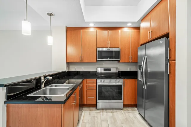 a view of a kitchen with a sink