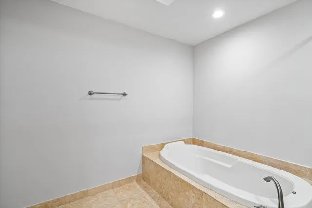 a bathroom with a sink a toilet a mirror and vanity