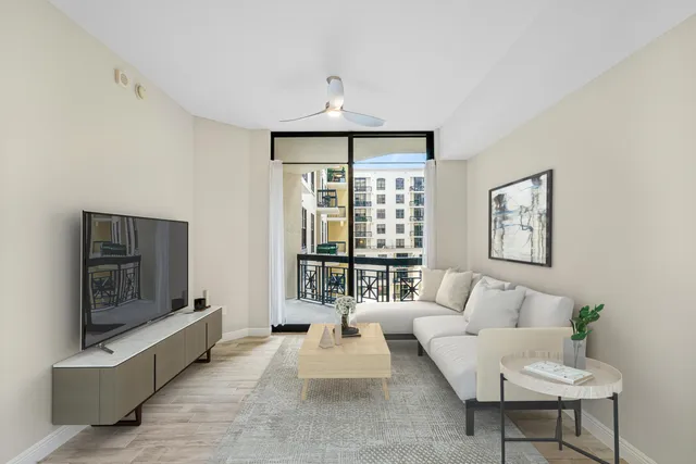 a view of a kitchen with a refrigerator and a window