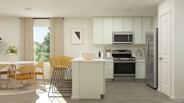 a kitchen with stainless steel appliances a stove a sink refrigerator and a microwave