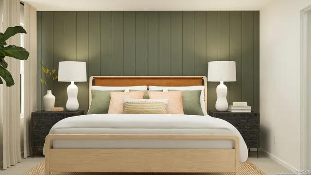 a bedroom with a bed and a lamp