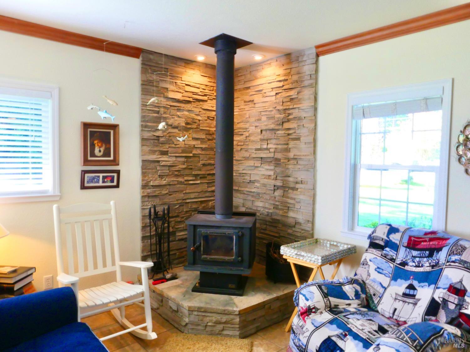 30860 Simpson Lane Fort Bragg, CA 95437 - Photo 11 of 33 a living room with furniture and a fireplace