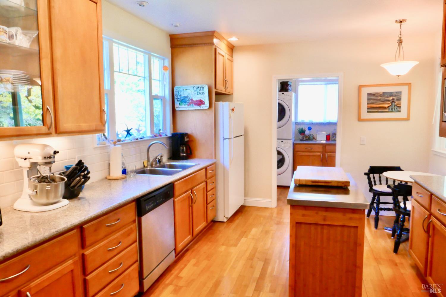 30860 Simpson Lane Fort Bragg, CA 95437 - Photo 13 of 33 a kitchen with stainless steel appliances a stove a sink and a refrigerator