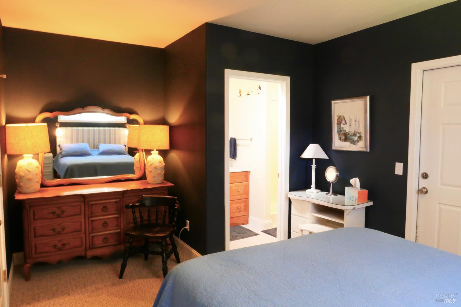 30860 Simpson Lane Fort Bragg, CA 95437 - Photo 18 of 33 a bedroom with a bed and a dresser in it