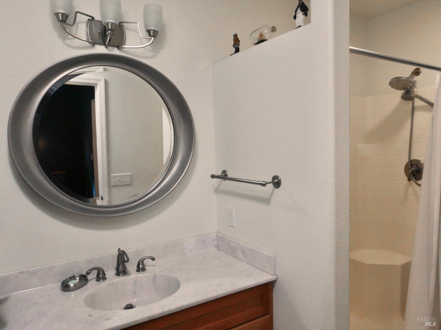 30860 Simpson Lane Fort Bragg, CA 95437 - Photo 20 of 33 a bathroom with a sink and a mirror