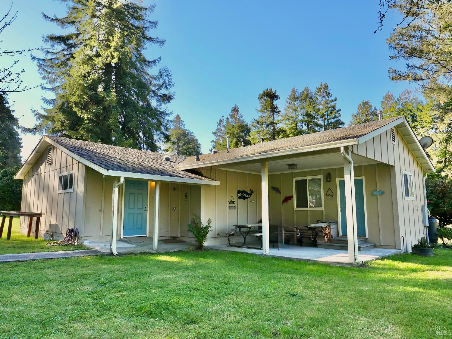 30860 Simpson Lane Fort Bragg, CA 95437 - Photo 5 of 33 a view of a house with a garden