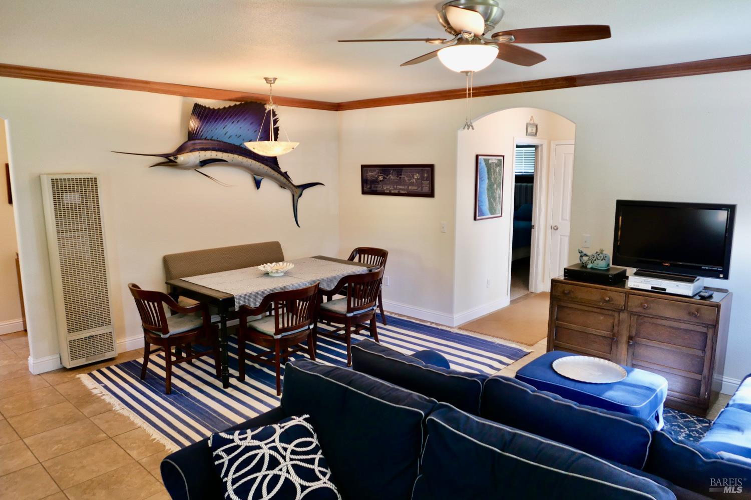 30860 Simpson Lane Fort Bragg, CA 95437 - Photo 10 of 33 a view of a livingroom with furniture and a flat screen tv