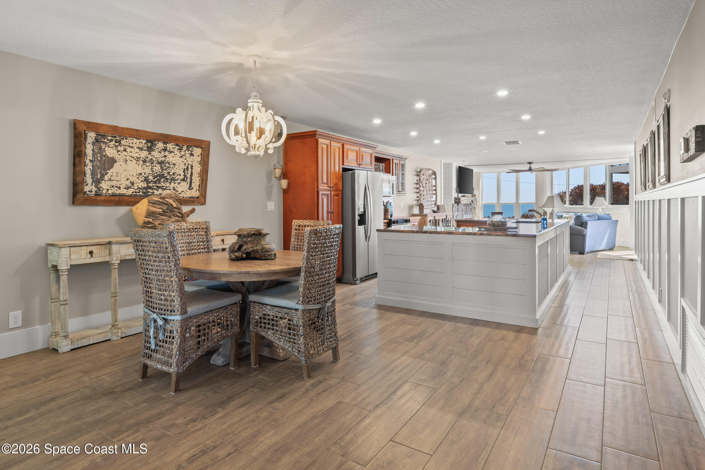 700 Wave Crest Avenue, Unit 206 Indialantic, FL 32903 - Photo 13 of 36 a kitchen with stainless steel appliances kitchen island granite countertop a sink and cabinets