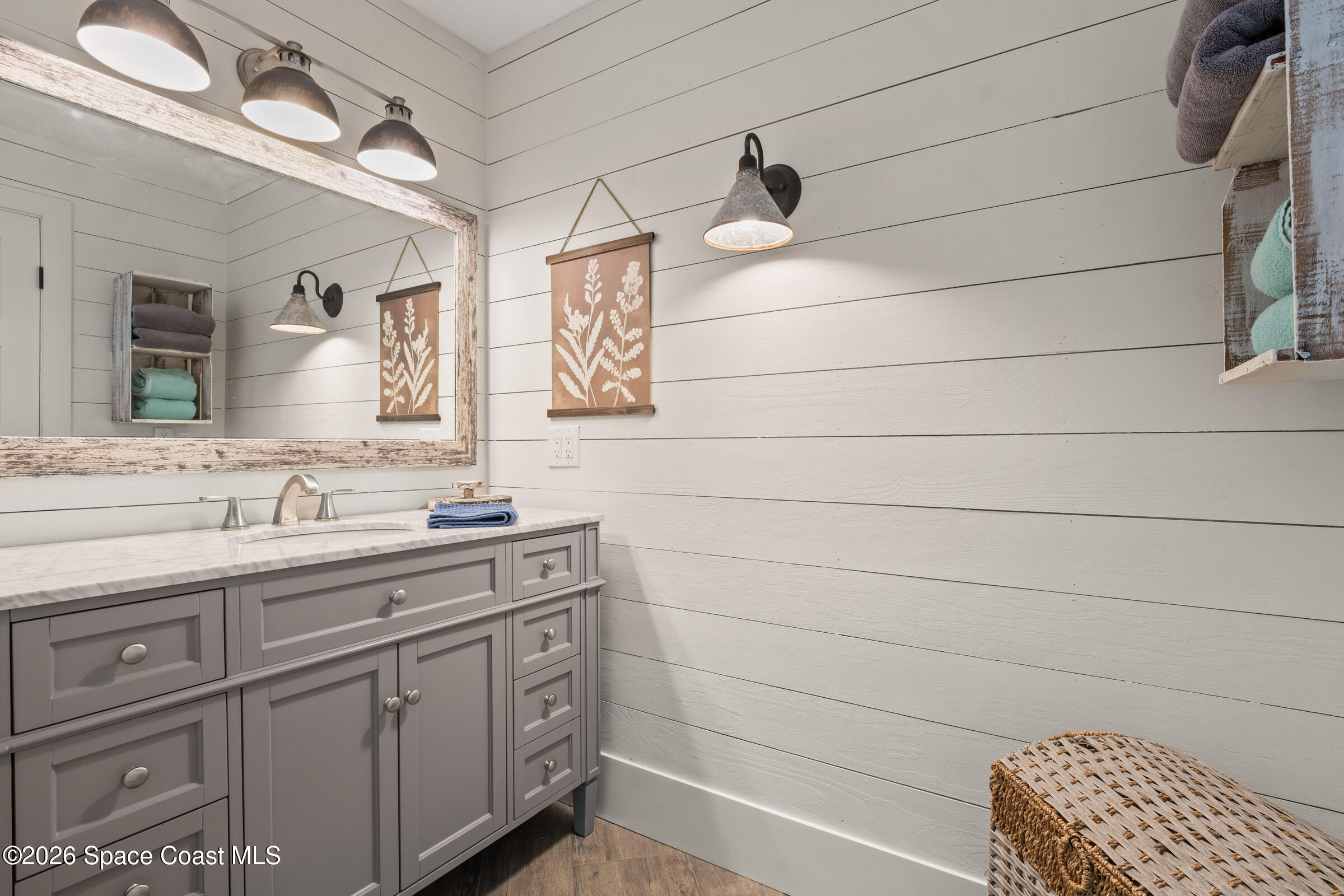 700 Wave Crest Avenue, Unit 206 Indialantic, FL 32903 - Photo 23 of 36 a bathroom with a sink and a mirror