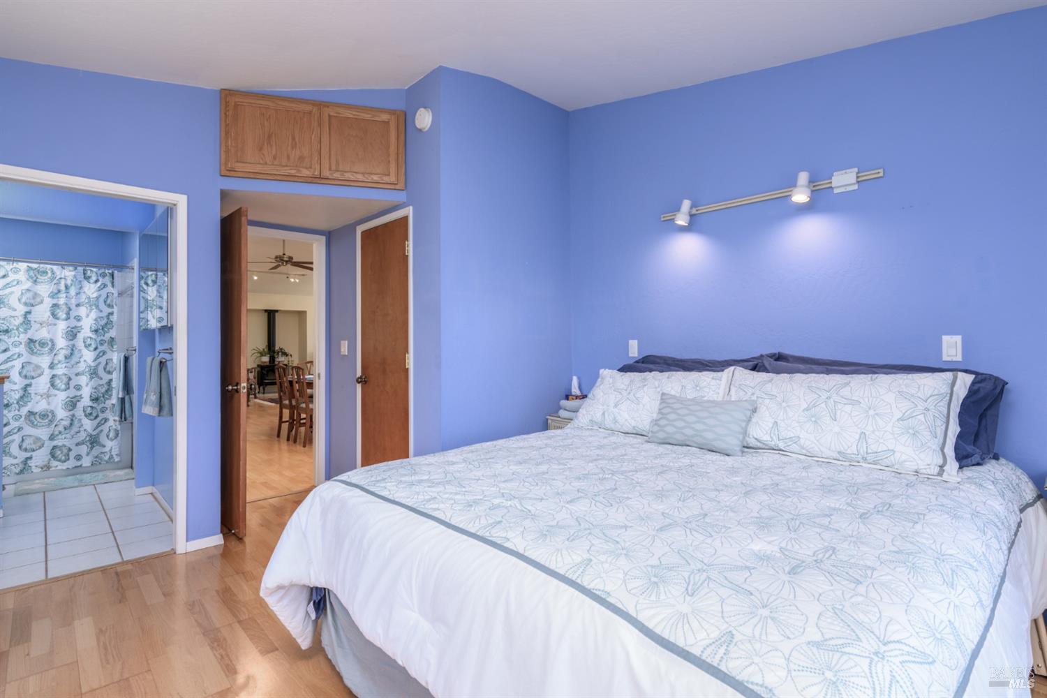15721 Forest View Road Manchester, CA 95459 - Photo 24 of 50 The main, ensuite bedroom / bath features views, deck access, Golden Oak flooring and walk-in closet...
