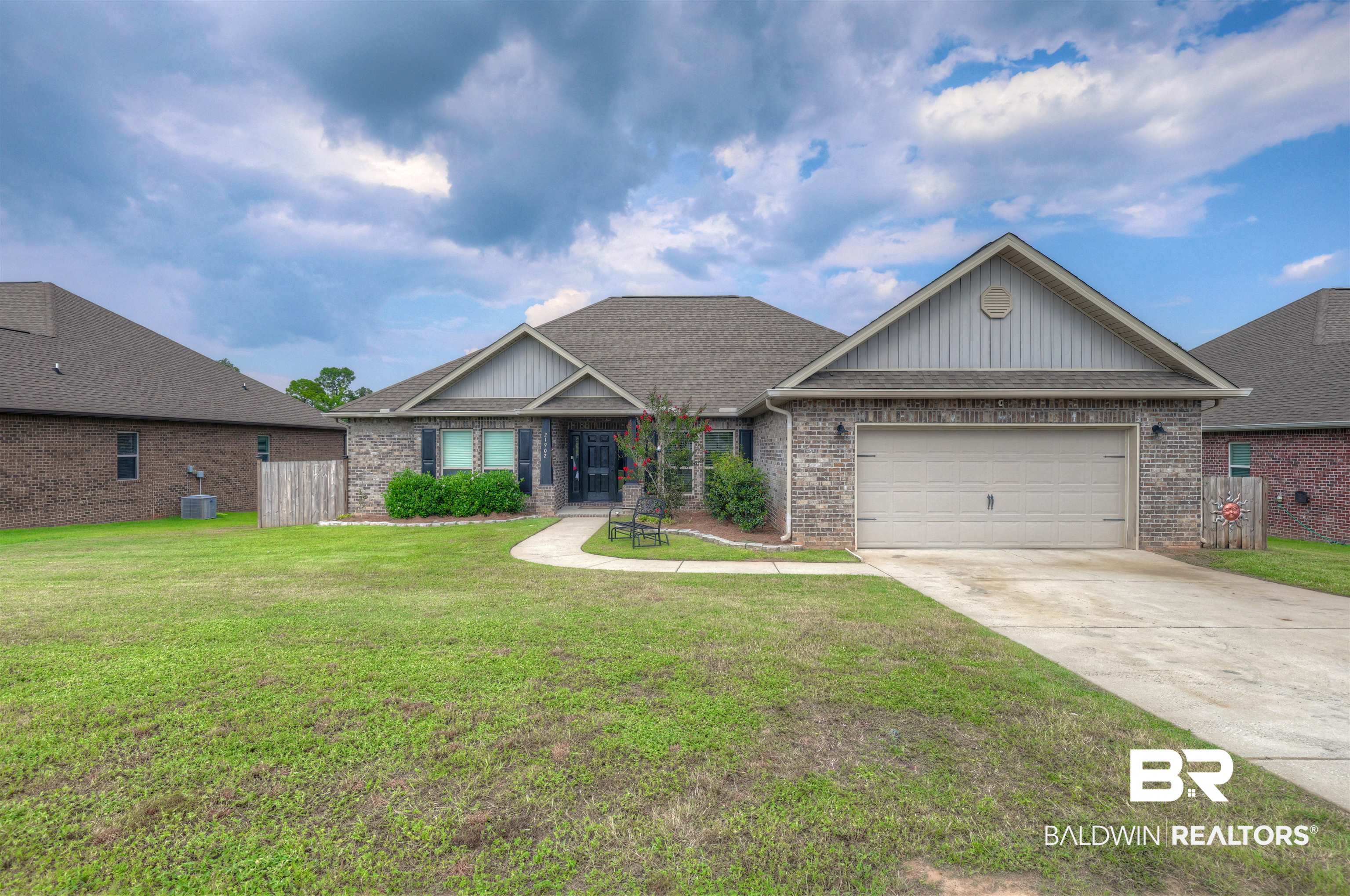 21902 Yosemite Boulevard Fairhope, AL 36532 - Photo 28 of 32 Craftsman house featuring a front lawn and a garage