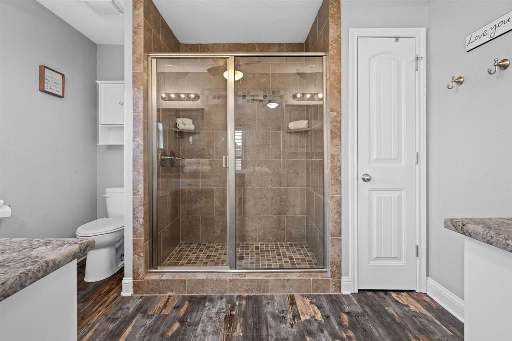 175 Porter Road Bartonville, TX 76226 - Photo 21 of 40 a bathroom with a shower and a toilet