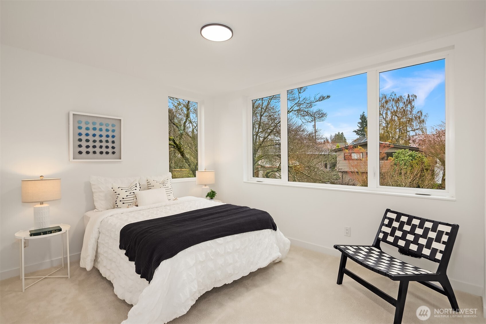 2340 North 64th Street, Unit A Seattle, WA 98103 - Photo 15 of 29 a bedroom with a bed and a window