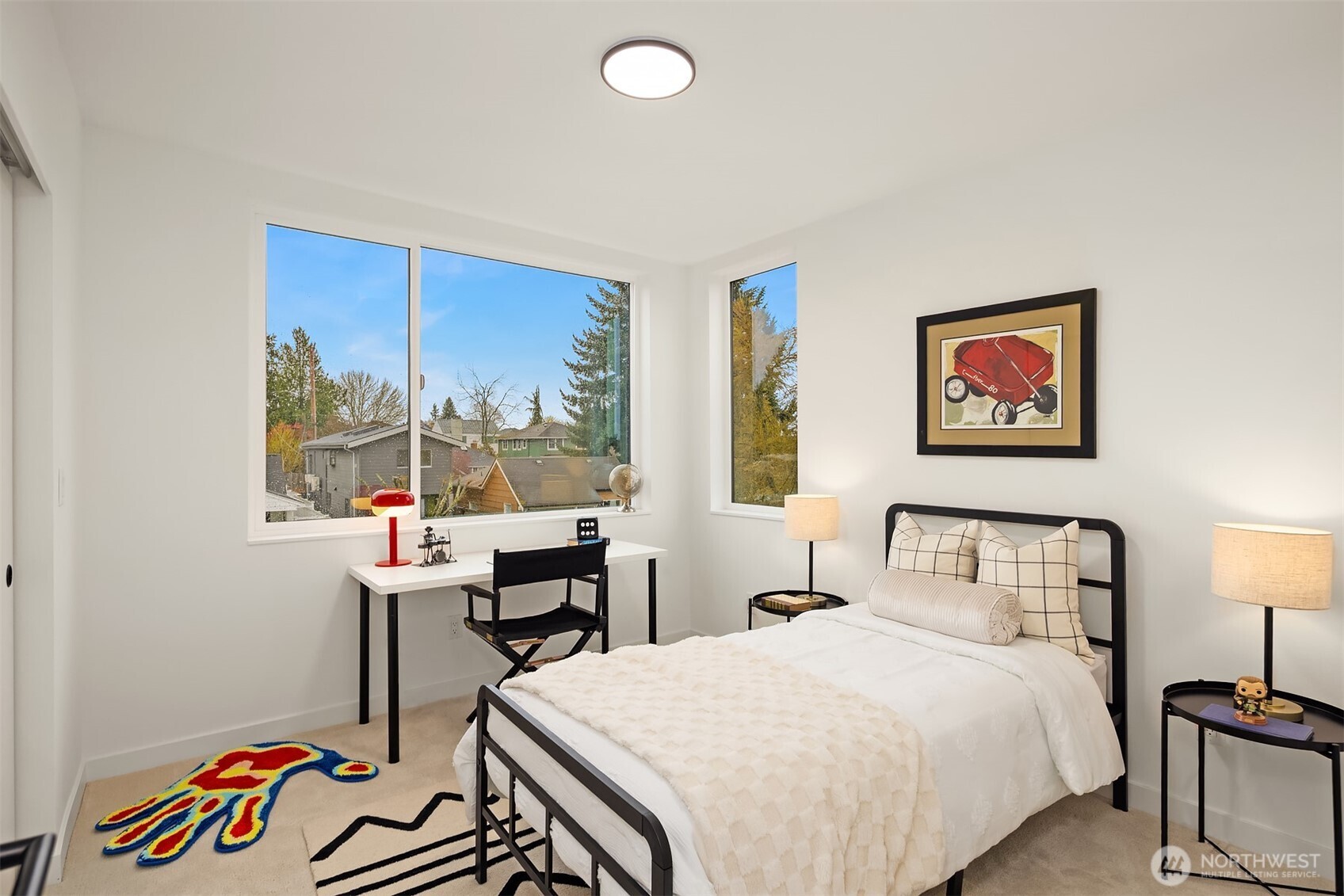 2340 North 64th Street, Unit A Seattle, WA 98103 - Photo 16 of 29 a bedroom with a bed and a table