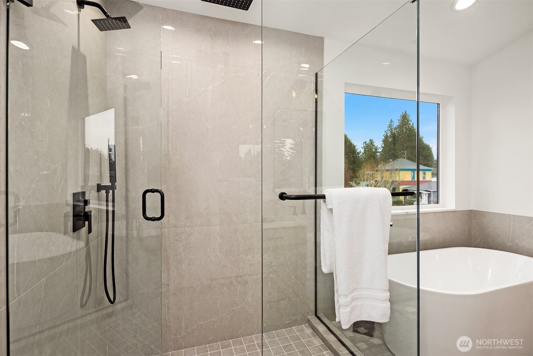 2340 North 64th Street, Unit A Seattle, WA 98103 - Photo 21 of 29 a bathroom with a tub and shower
