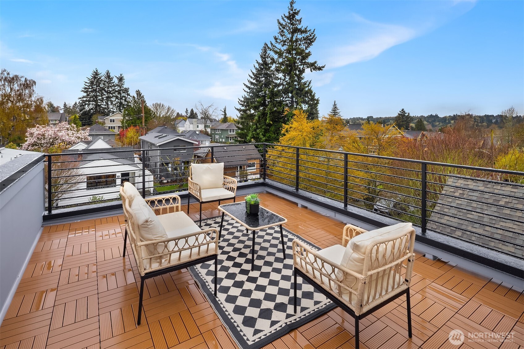 2340 North 64th Street, Unit A Seattle, WA 98103 - Photo 24 of 29 a view of a roof deck with couches and wooden floor