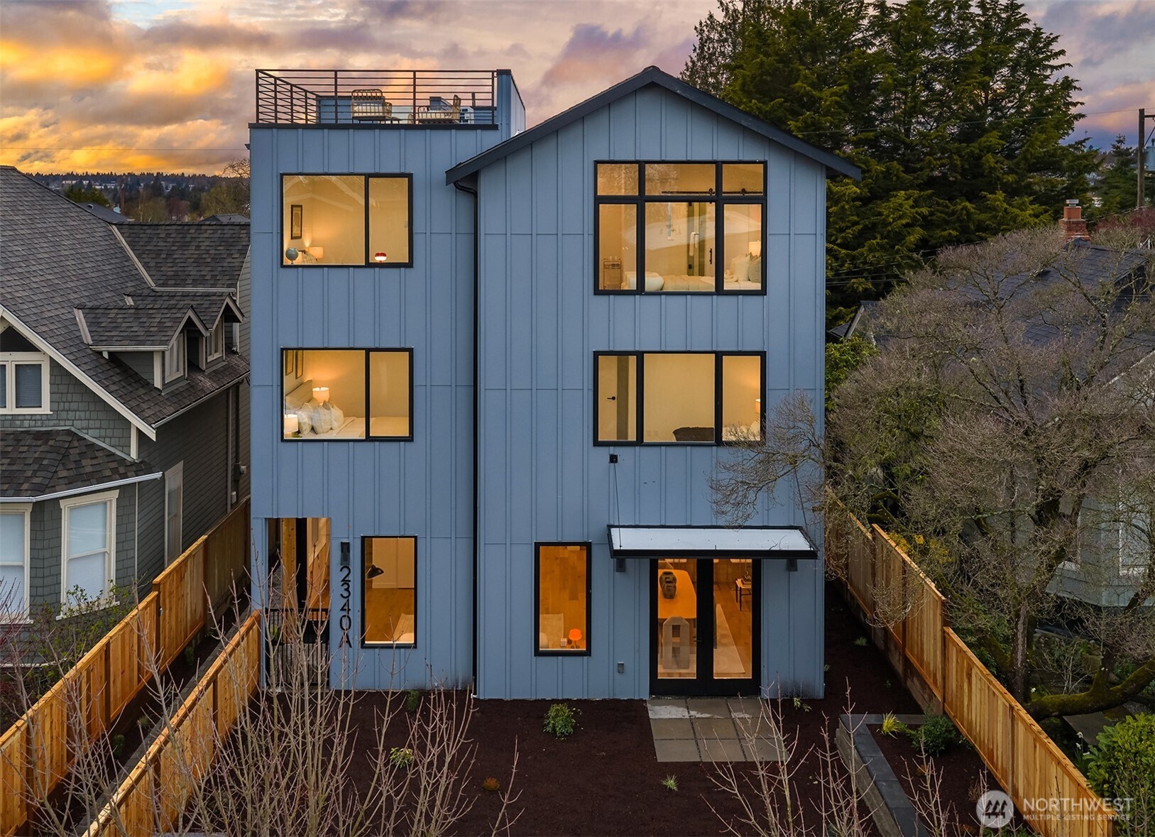 2340 North 64th Street, Unit A Seattle, WA 98103 - Photo 27 of 29 a front view of a house with glass windows and brick walls