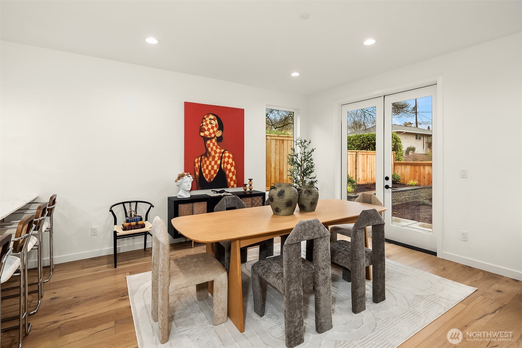 2340 North 64th Street, Unit A Seattle, WA 98103 - Photo 4 of 29 a view of a dining room with furniture window and wooden floor